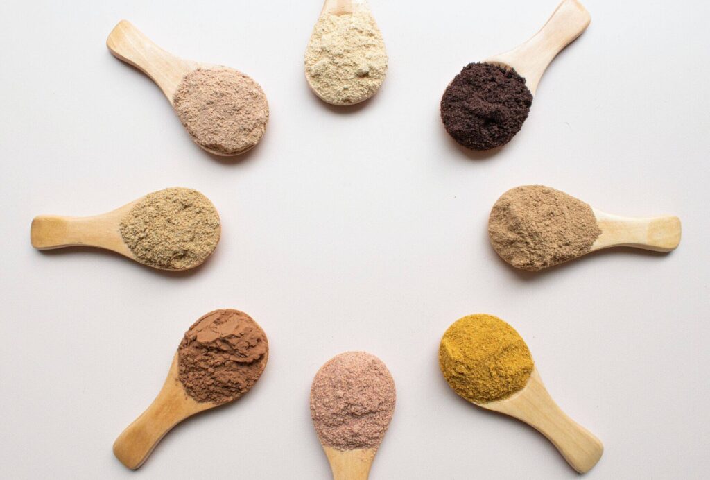 A variety of flavoring powders on spoons