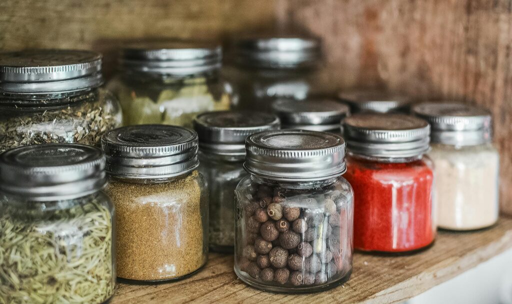 Whole and ground spices on a shelf