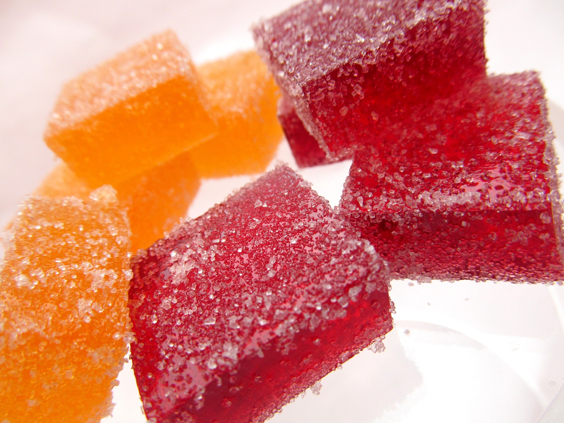 A selection of sweet jelly candy in red and orange