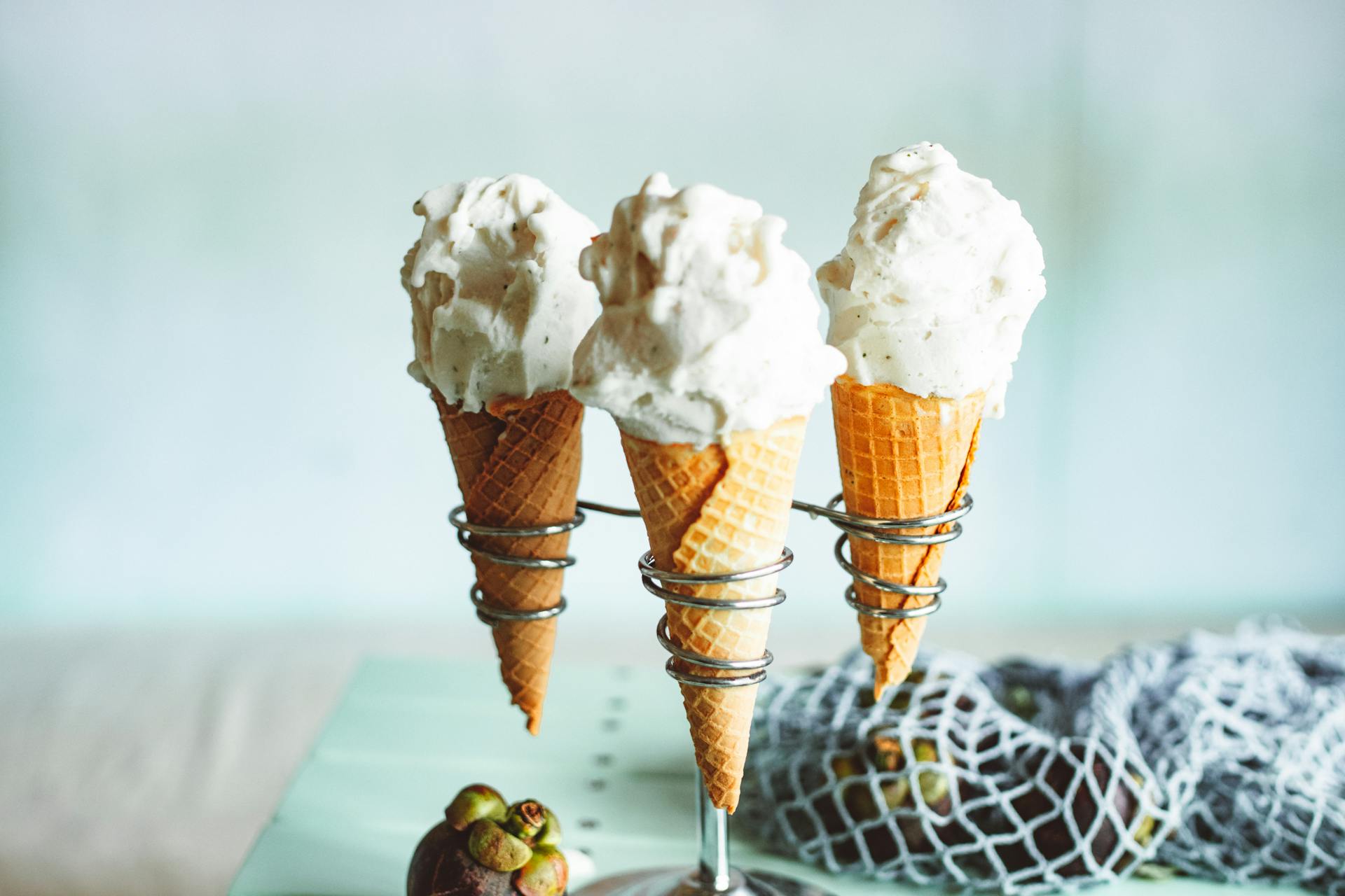 Three cones with vanilla ice cream